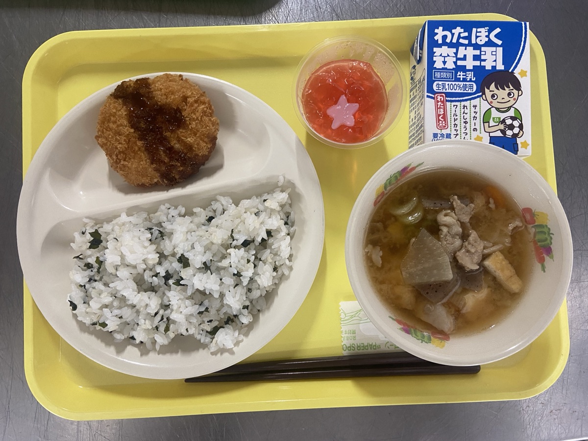 School lunch celebration tray: herb rice, menchi-katsu, kenchin soup, handmade celebration jelly, and milk